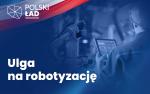 Tekst:Ulga na robotyzację. Mężczyzna z tabletem w dłoni obok maszyny produkcyjnej (robota)